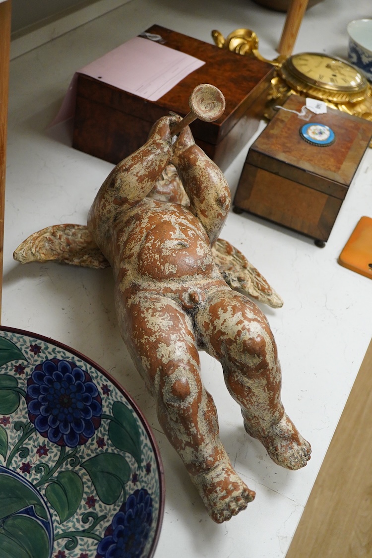 A decorative simulated gesso wall putti, in Baroque style, approximately 55cm high